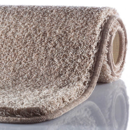 Rutschfester Badezimmerteppich "Montana" in warmem Sand-Taupe meliert.