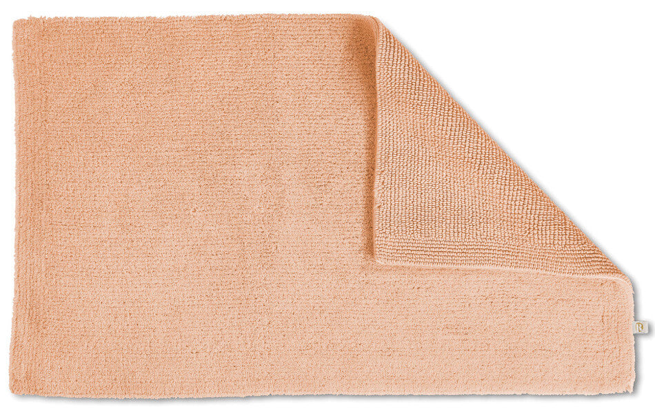 Badezimmerteppich Baumwolle Pur in Peach, sanfte Farben für ein harmonisches Bad.