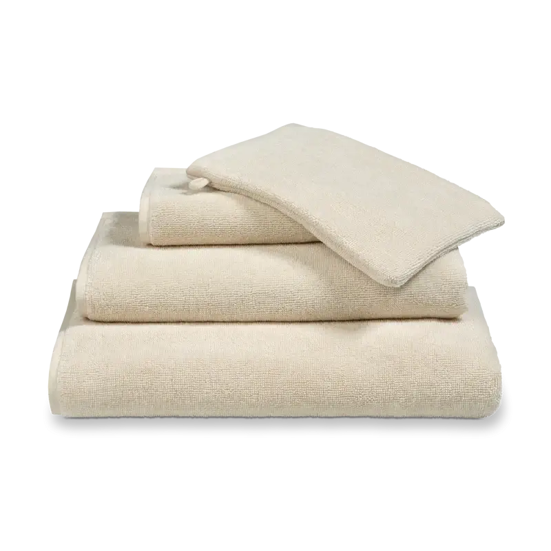 Handtuch Verona in Desert Beige Creme von Vandyck aus saugstarker Baumwolle für ein stilvolles Badezimmer.