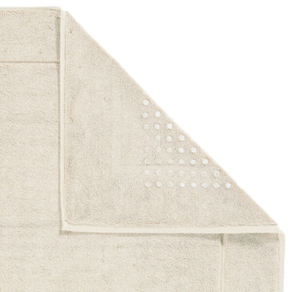 Stilvoller Badteppich mit rutschhemmender Unterseite in natürlichem Birken-Ton.