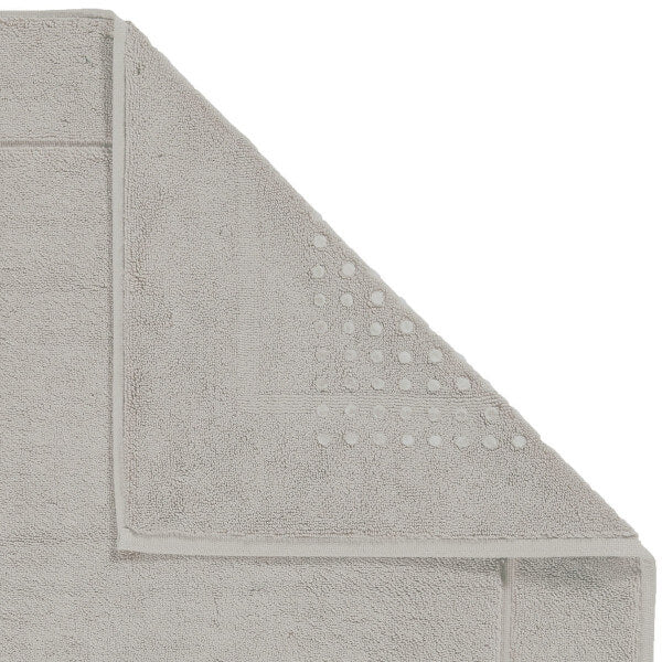 Eleganter Badteppich mit rutschhemmender Unterseite in tiefem Trüffel-Braun.