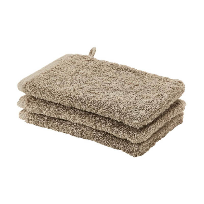 Hochwertige Baumwoll-Waschhandschuhe von Aquanova London (Almond) – ideal für sanfte Pflege.